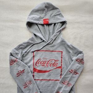 Women's Coca-Cola multi-language cropped hoodie in heather gray. Size Small